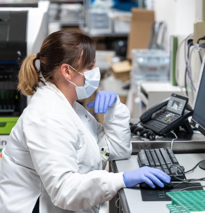 Caregiver in Lynchburg General Hospital's laboratory doing research